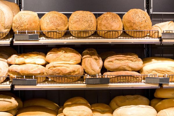A rack of fresh baked bread at the store.