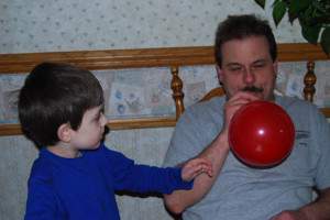 Husband and Son working on Balloon Rocket