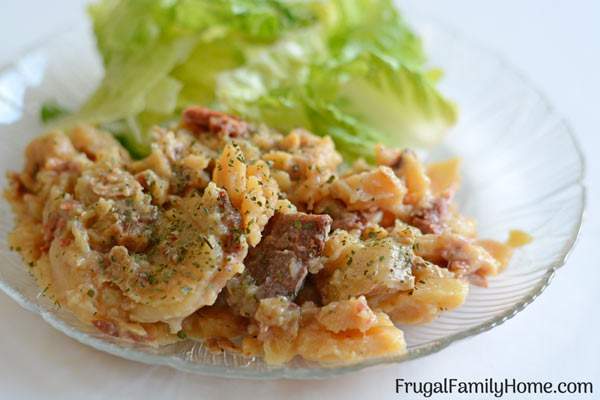 Slow Cooker Scalloped Potatoes and Ham- This i s an easy recipe or Scalloped potatoes and ham that can be made in the crock pot. This is a creamy and cheesy scalloped potato recipe that can be made dairy free too. Plus it's less than $1 serving.