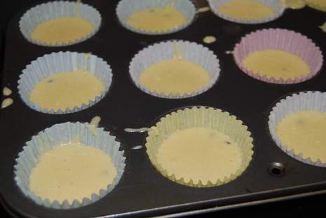Choclate chip batter added to muffin tin