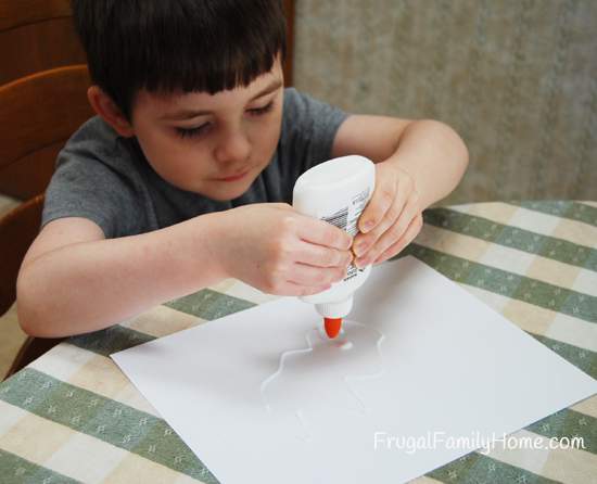 Son working hard on glue