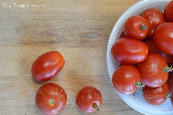 If you have a bunch of tomatoes from your garden and you don’t have time to dry or can them, why not freeze them? Did you know you can freeze tomatoes whole? No need to slice, dice or even peel them. It’s super easy to do and they work great in sauces, soups, stews, and chili.