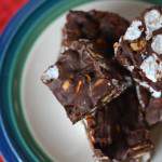 I’ve been making this recipe for Rocky Road fudge for years and it always turns out great. It only takes 6 ingredients and about 10 minutes to make from start to finish. It’s also so easy to a make in the microwave that the kids can help with making this fudge. I always include it on my Christmas cookie and candy plate each year. Great to take to holiday parties too.