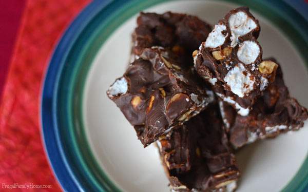 I’ve been making this recipe for Rocky Road fudge for years and it always turns out great. It only takes 6 ingredients and about 10 minutes to make from start to finish. It’s also so easy to a make in the microwave that the kids can help with making this fudge. I always include it on my Christmas cookie and candy plate each year. Great to take to holiday parties too. 