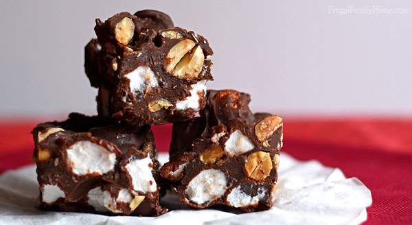 I’ve been making this recipe for Rocky Road fudge for years and it always turns out great. It only takes 6 ingredients and about 10 minutes to make from start to finish. It’s also so easy to a make in the microwave that the kids can help with making this fudge. I always include it on my Christmas cookie and candy plate each year. Great to take to holiday parties too. 