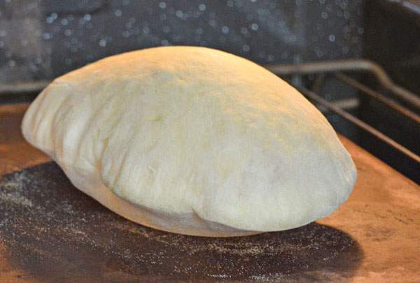 Pita bread freshly baked coming out of the oven Stock Photo