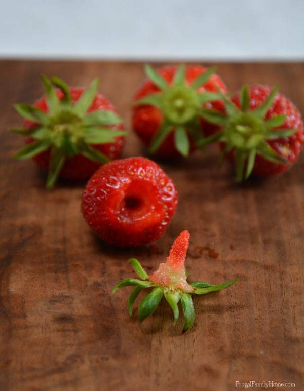 Hulling strawberries, Frugal Family Home