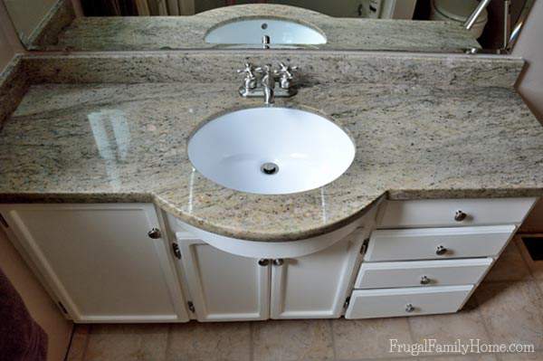 The new granite countertop is a nice neutral color with a little green and black. | Frugal Family Home