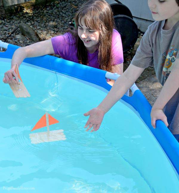 Popsicle stick raft in the pool | Frugal Family Home