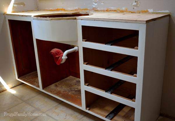 The vanity countertop removed and the vanity is primed and ready for the new countertop | Frugal Family Home