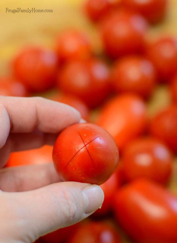 Cut a little x in the bottom of the tomato to make it easier to peel | Frugal Family Home