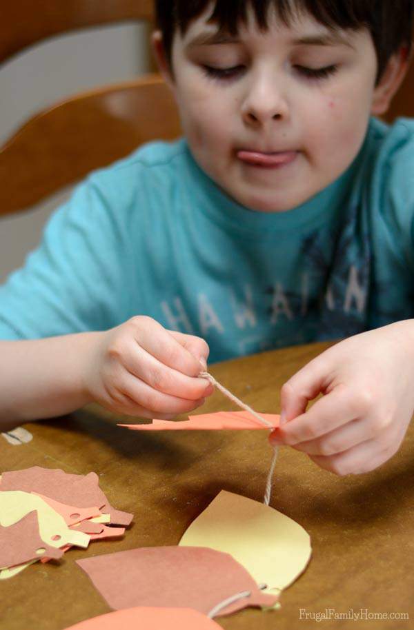 Easy kid's craft for fall, leaf garland | Frugal Family Home