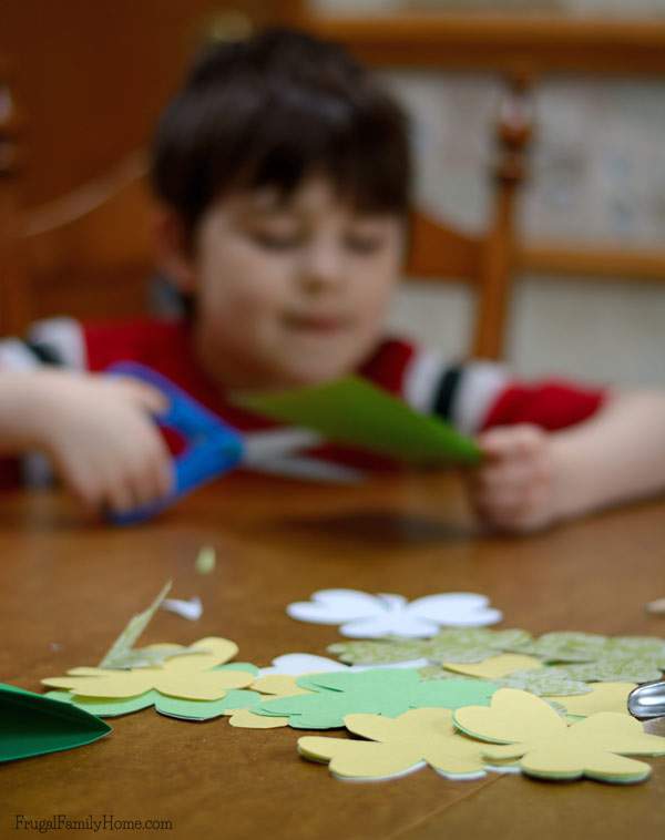 Easy craft for St. Patrick's Day, make a Shamrock Garland to display.