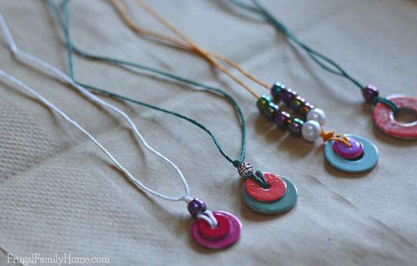 This is a great project to do with the kids, when the summer heat is just too hot outside or on a rainy day. These DIY washer necklaces only take a few items to make. A few washers, beads, nail polish, and a little string is all that is needed to make these really cute necklaces. This is a great idea to get your kids creating instead of complaining. 