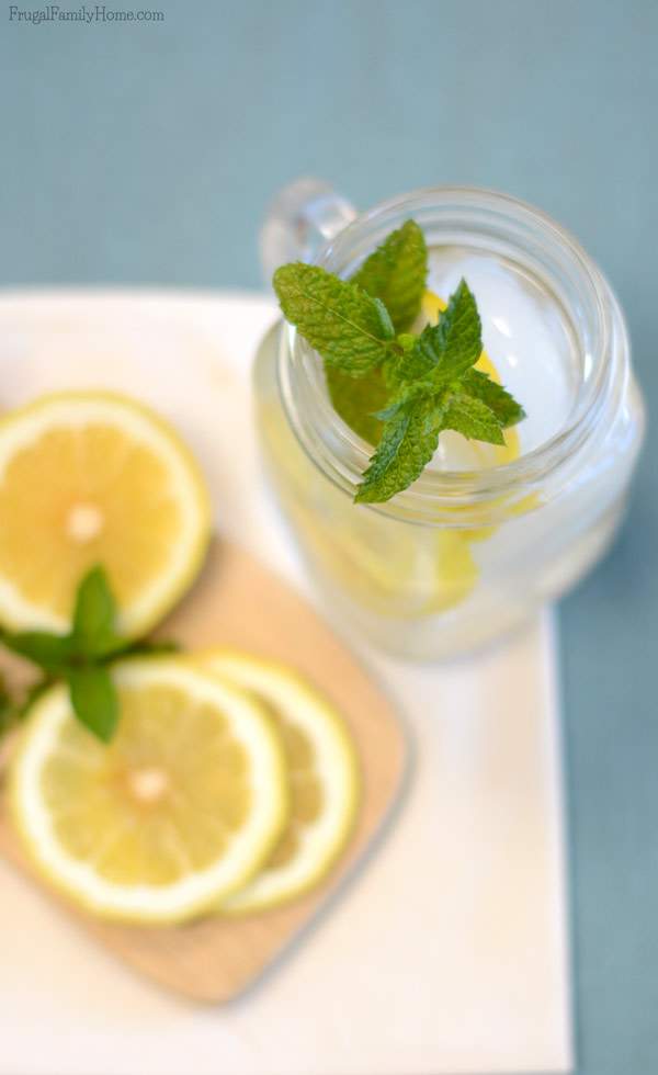 This summer drink recipe has fast become one of my favorites and I think it will become one of your favorites too. This lemon mint water recipe is super simple to make but oh so refreshing. Just two, well three ingredients if you count the water, 30 minutes and you have a refreshing summer drink.