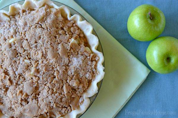 I know this time of year I love to make apple recipes. Apple pie is one of my favorite fall desserts. If you also love to enjoy apples you’re going to want to give this Apple Crumble Pie Recipe a try. It has a crunchy topping over slightly tart apples that make the best pie ever. 