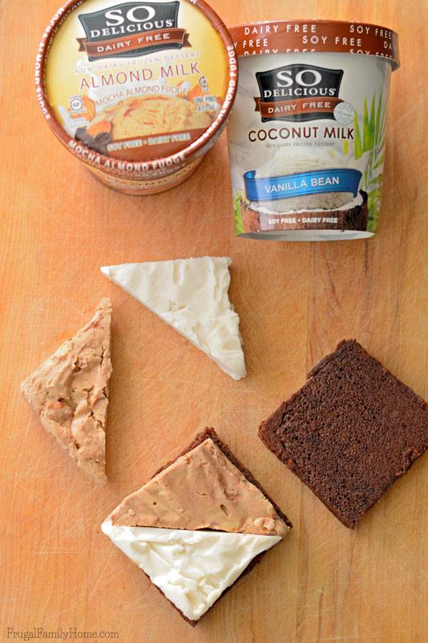 Need a delicious dairy-free dessert to serve? These easy to make frozen brownie sandwiches are dairy free. They have two flavors of frozen dessert sandwiched between a dairy free brownie. Make them fancier by cutting them up and adding them to a stemmed glass. Sprinkle with nutmeg for Thanksgiving or with crushed candy canes for Christmas. They are sure to be a delicious dessert anyway you make them. #DairyFree4All [AD]