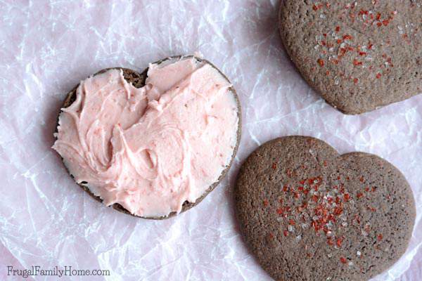 I knew I would love these cookies as soon as I saw them. I mean they are so cute but once you make them you’ll see just how delicious they are too. This chocolate covered strawberry cookie recipe is so easy to make but turns out so yummy too. Great for a Valentine’s Day dessert or for a Valentine’s Day party. These are not your average Valentine’s Day cookie.