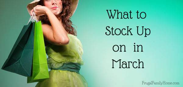 Lady in a green dress with packages for what to stock up on in March.