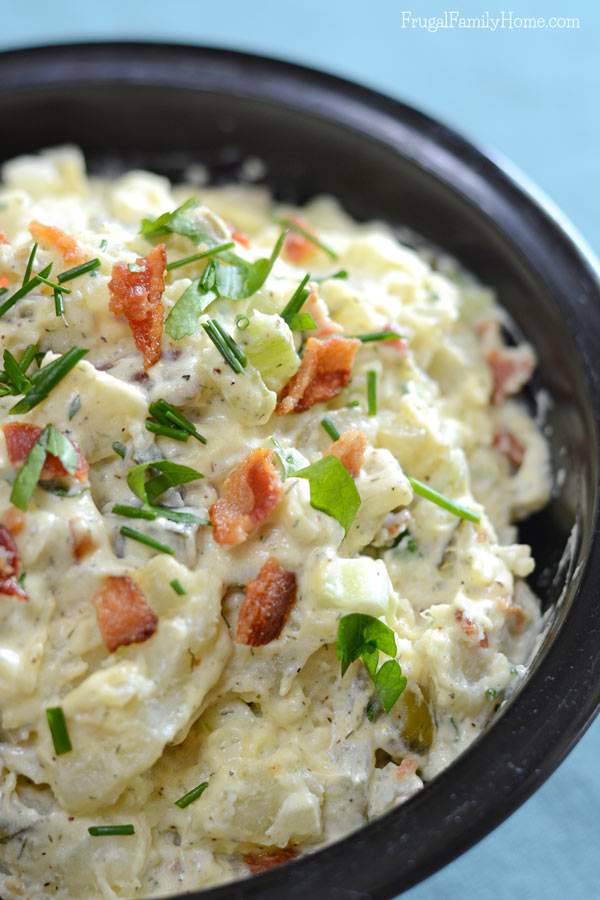 This is the best potato salad recipe ever. It has the creaminess of original potato salad but with an added crunch of bacon. Yum, who can resist bacon? Then add the fresh taste of the parsley and chives to make the perfect potato salad recipe. I love to make this recipe for barbecues and parties, everyone raves about it.