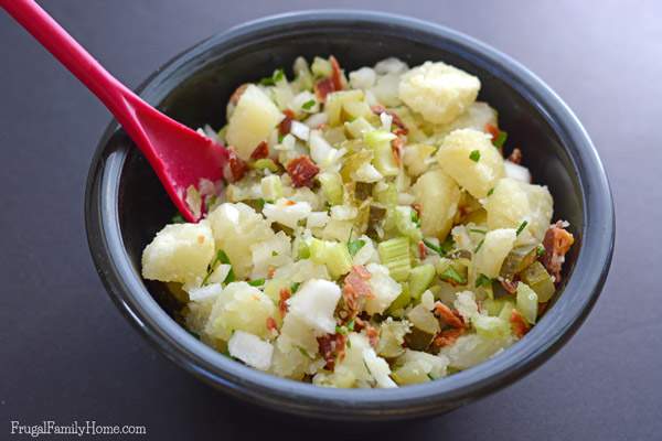 This is the best potato salad recipe ever. It has the creaminess of original potato salad but with an added crunch of bacon. Yum, who can resist bacon? Then add the fresh taste of the parsley and chives to make the perfect potato salad recipe. I love to make this recipe for barbecues and parties, everyone raves about it. 