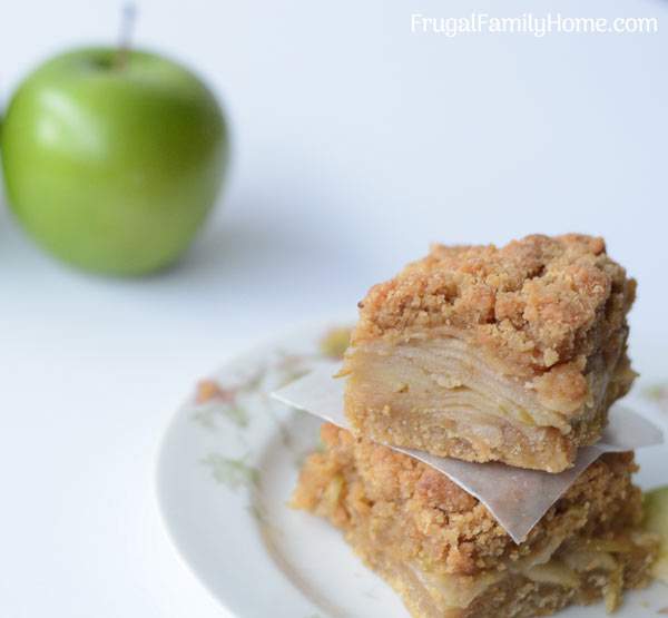 This is an easy apple recipe that is great for fall or anytime of the year. These apple crumble bars have a nice layer of apples that sit on top of a layer of shortbread crust. Then sprinkled on top is a golden crumble topping. I love to make this recipe for dessert but it’s equally good as a breakfast bar too. You need to try this delicious apple recipe.