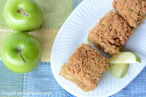 This is an easy apple recipe that is great for fall or anytime of the year. These apple crumble bars have a nice layer of apples that sit on top of a layer of shortbread crust. Then sprinkled on top is a golden crumble topping. I love to make this recipe for dessert but it’s equally good as a breakfast bar too. You need to try this delicious apple recipe.