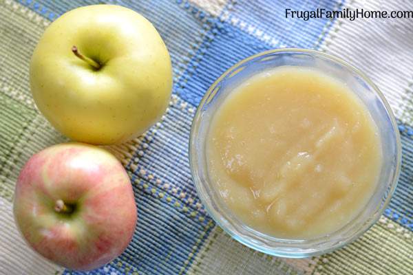 Two Ingredient Easy Homemade Applesauce Recipe- This homemade applesauce recipe is so easy to make with only two ingredients it’s healthy too. It’s prepared on the stovetop with no sugar added. We love this super simple applesauce recipe.