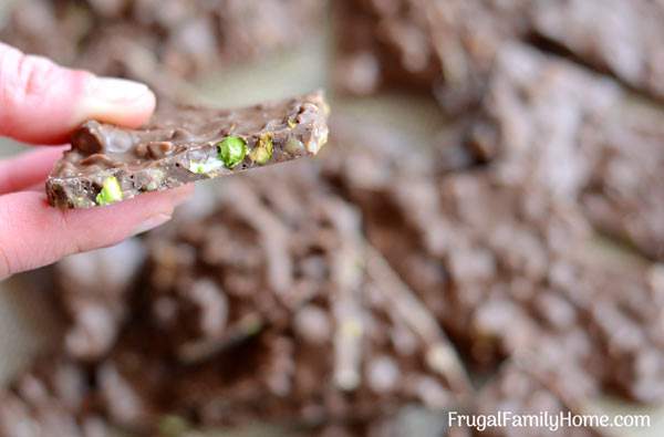 An easy recipe for Pistachio Toffee Bark ~ This candy recipe is super easy but you don’t have to let anyone know that. Impress your friends by making them a batch of this homemade pistachio bark candy for Christmas. It’s easy to make only taking 3 ingredients and about 5 minutes to make. There’s even a step by step video tutorial for this candy recipe.