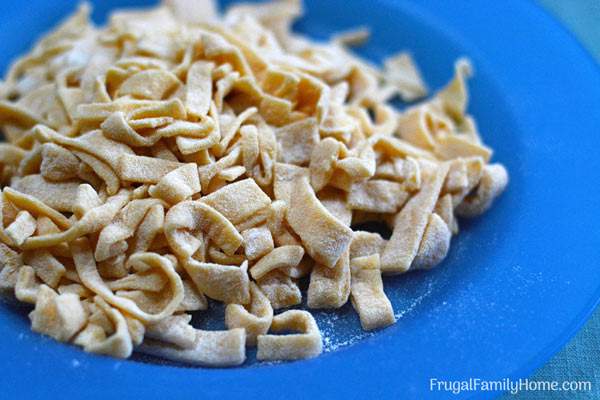 Homemade Egg Noodles recipe, this is an easy homemade recipe for egg noodles that doesn’t require a pasta machine to make. Cook them in chicken broth and leftover chicken and you have a frugal easy meal.