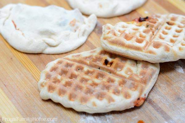 Quick and Easy Waffle Pizza, when it’s too hot to bake pizza we make pizza in the waffle iron. These pizza pockets turn out crisp and melty, just perfect for a quick and fun pizza dinner or lunch.