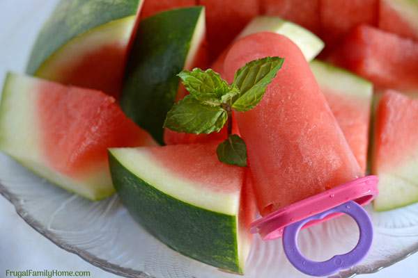 How to Make Homemade Watermelon Popsicles with mint. This is a simple, easy, and healthy recipe for watermelon popsicles that kids and adults will love. The added mint makes them cool and refreshing on a hot summer day.