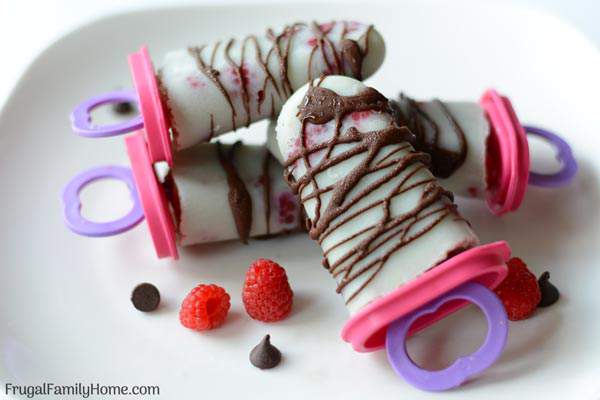 Raspberry Cream Popsicles, these popsicles make a healthy summer dessert for everyone. It’s a super easy recipe with only 3 ingredients needed. You can use coconut milk to make them dairy free too.
