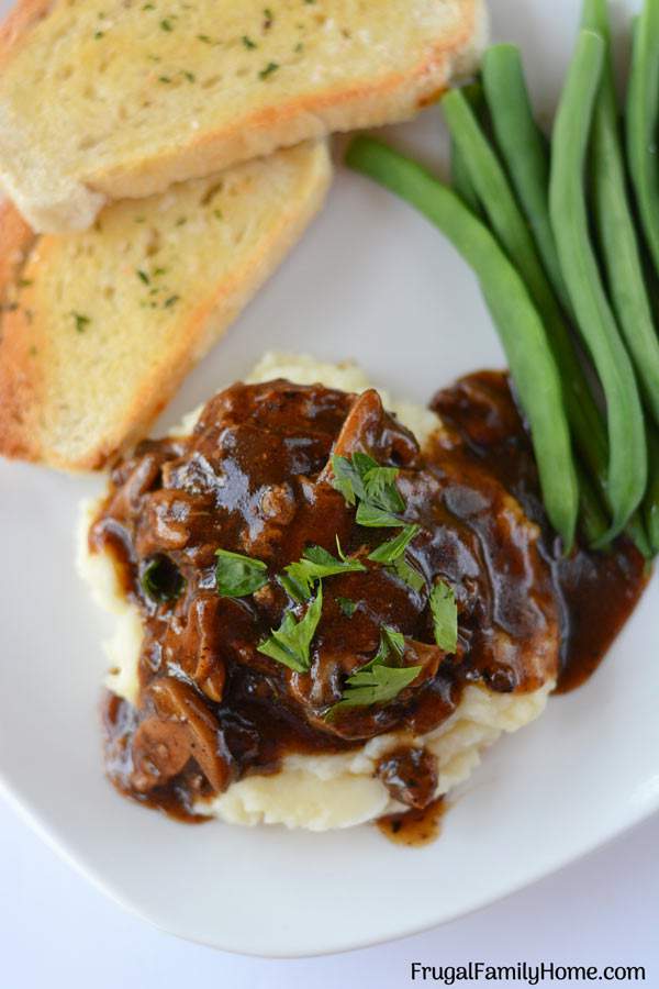 A simple and easy Salisbury steak recipe with mushroom gravy. This is an easy recipe for Salisbury steak that only takes about 30 minutes to make and costs less than $1 per serving.