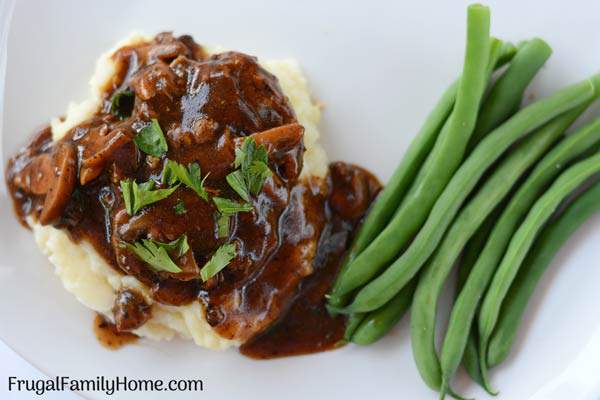A simple and easy Salisbury steak recipe with mushroom gravy. This is an easy recipe for Salisbury steak that only takes about 30 minutes to make and costs less than $1 per serving.