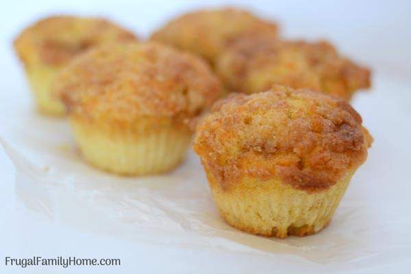 Easy to make crumb cake muffins with pumpkin. These pumpkin muffins are the best, most moist from scratch muffins you can make. They are perfect for fall. The recipe has vegan options too.
