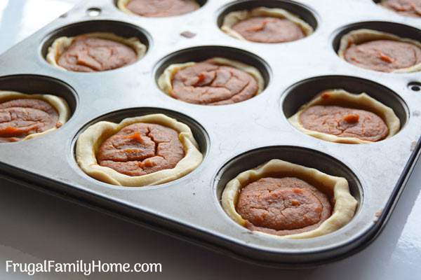 Make these mini pumpkin pies from scratch for Thanksgiving. This is an easy recipe that is vegan, dairy free, and egg free too. They are easy to make since they are baked in a muffin tin and the filling is quickly mixed up in a food processor too. Everyone will love these individually sized pumpkin pies.