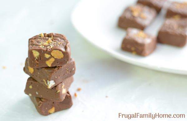 We love this quick and easy no bake chocolate fudge recipe. Make a batch and give it as a Christmas gift or enjoy it yourself. This 4 ingredient fudge turns our smooth and creamy it just melts in your mouth.