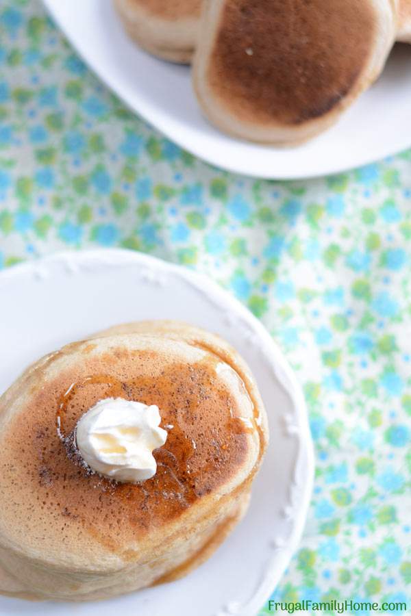 This easy whole wheat pancake recipe is easy to make and healthy too. It doesn’t contain eggs or oil. You can make it dairy free by using almond milk or another non dairy milk. It’s a great weekend breakfast but fast enough to be made on a weekday too. Even though these pancakes are made with whole wheat, they are light and fluffy. Come see what the secret is to making them fluffy instead of heavy and dense.