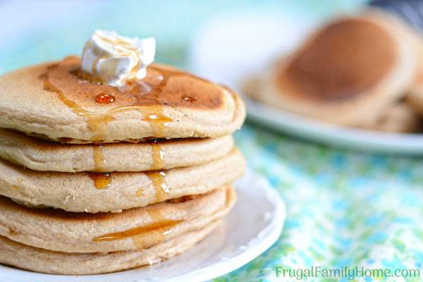 This fluffy whole wheat pancake recipe is easy to make and healthy too. It doesn’t contain eggs or oil. You can make it dairy free by using almond milk or another non dairy milk. It’s a great weekend breakfast but fast enough to be made on a weekday too. Even though these pancakes are made with whole wheat, they are light and fluffy. Come see what the secret is to making them fluffy instead of heavy and dense.