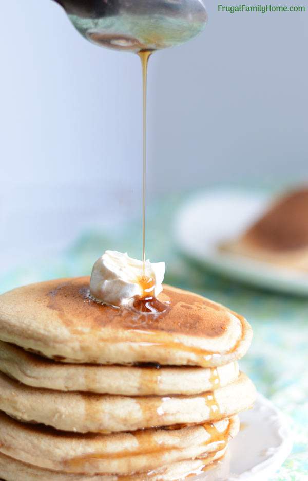 This whole wheat pancake recipe is easy to make and healthy too. It doesn’t contain eggs or oil. You can make it dairy free by using almond milk or another non dairy milk. It’s a great weekend breakfast but fast enough to be made on a weekday too. Even though these pancakes are made with whole wheat, they are light and fluffy. Come see what the secret is to making them fluffy instead of heavy and dense.