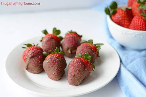 Homemade chocolate covered strawberries on a plate.