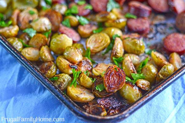 A super easy sausage and vegetable sheet pan dinner. Make your own combination of onions, Brussels sprouts, and potatoes roasted in the oven for a quick dinner. That’s easy to clean up too since it’s made in one pan.