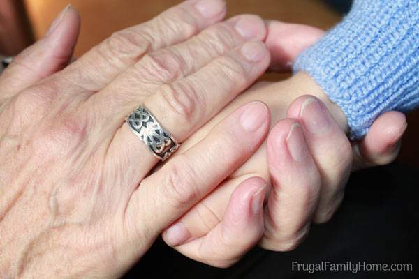 Grandma holding a child's hand.