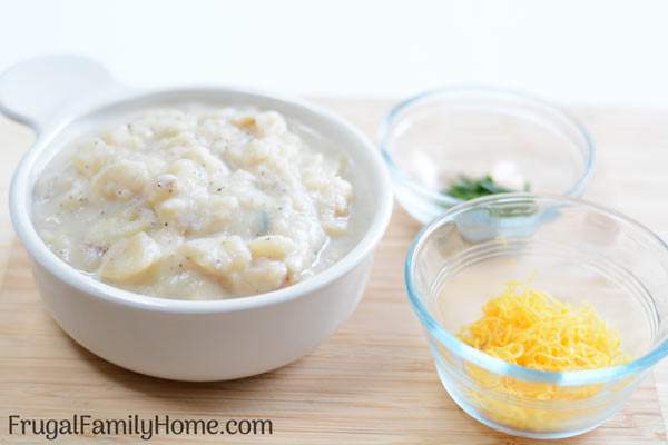 Homemade potato soup served with cracker.