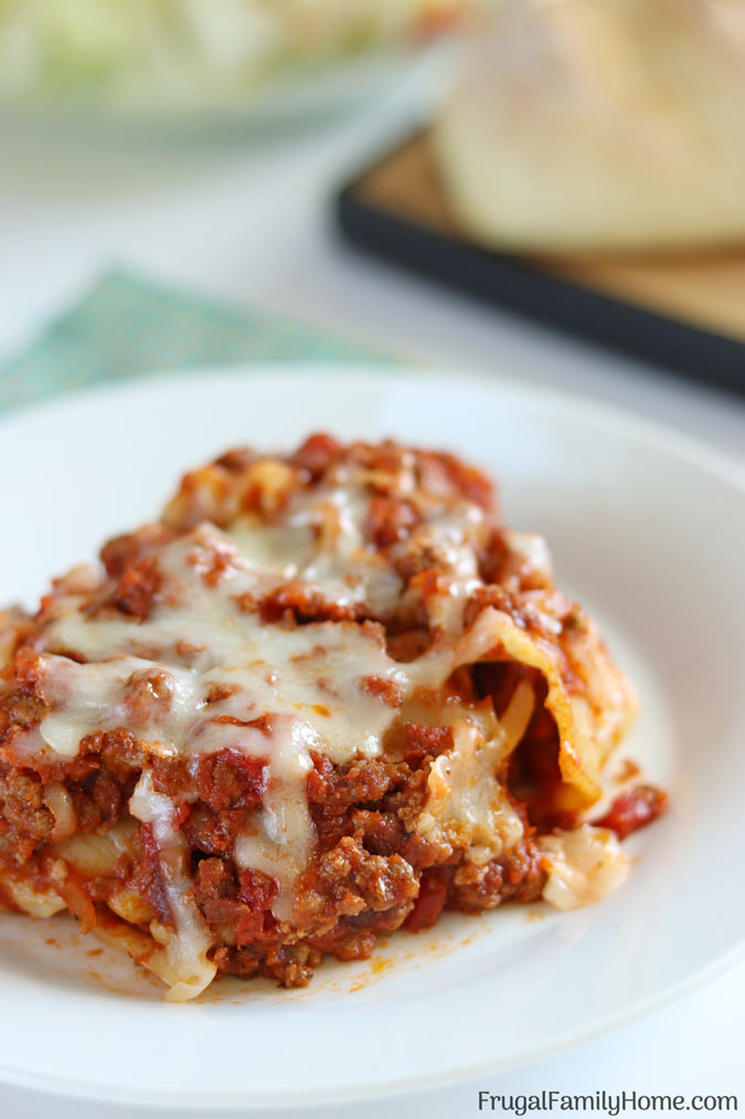 A delicious piece of slow cooker lasagna on the plate.