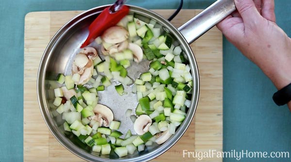 Zucchini hash vegetables cooking in the skillet