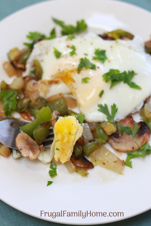 Yummy zucchini breakfast hash with an egg on top. 