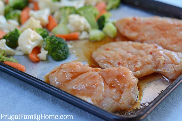 The sweet chili chicken recipe on a sheet pan ready to bake