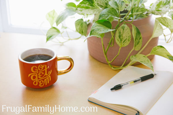 Planning your new year goals on a notebook and with a inspirational mug